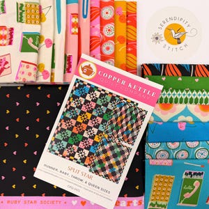 May include: A collection of colorful fabric bundles and a quilt pattern titled "Split Star" by Copper Kettle Quilt Company. The fabrics feature various patterns, including hearts, geometric shapes, and retro designs. A "Serendipity Stitch" sticker is also visible.