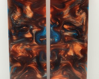 May include: Two rectangular pieces of resin with a swirling pattern of brown, blue, and gold. The resin is translucent and has a glossy finish.