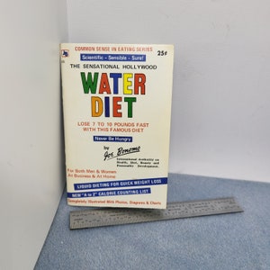 May include: Vintage paperback book titled "Water Diet" with colorful text. The cover includes the text "Lose 7 to 10 pounds fast" and "Never Be Hungry". The book is part of the "Common Sense in Eating Series".