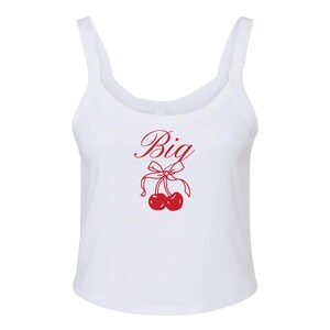 May include: White tank top with a red cherry graphic and the word "Big" in cursive.