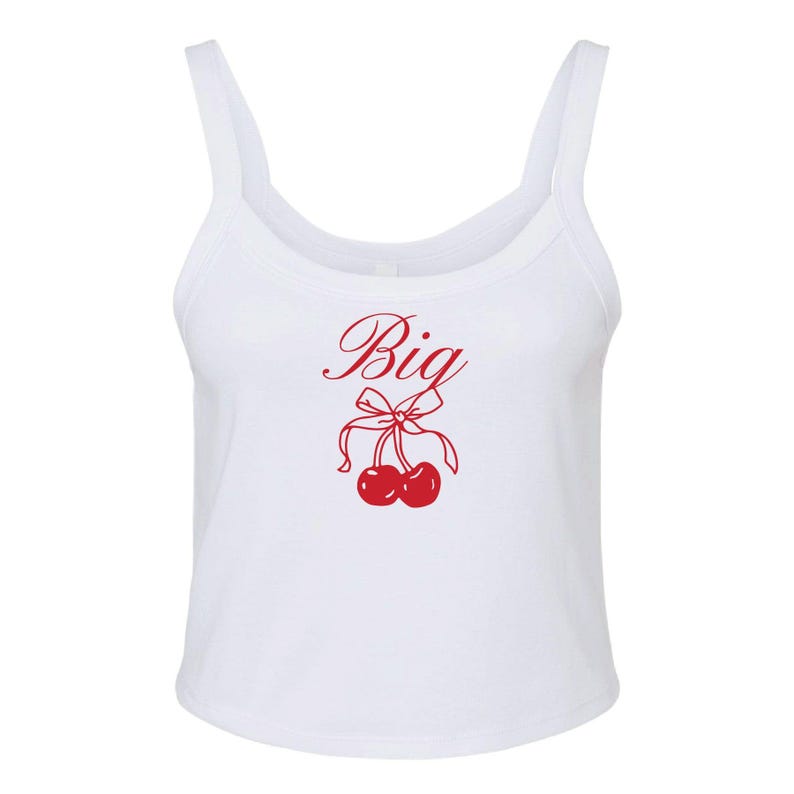 May include: White tank top with a red cherry graphic and the word "Big" in cursive.