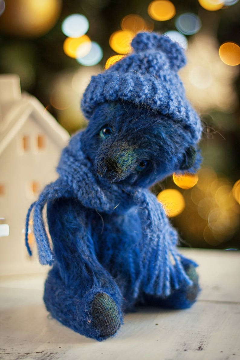 bat hugging teddy bear