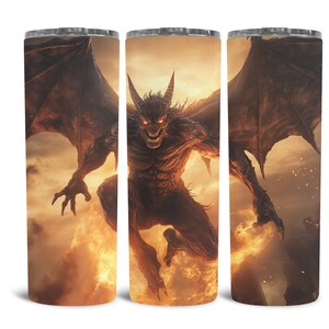 May include: A stainless steel tumbler with a design of a red-eyed, winged demon with horns, flying through a fiery orange and yellow sky.