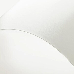 a close up of a white object on a white surface
