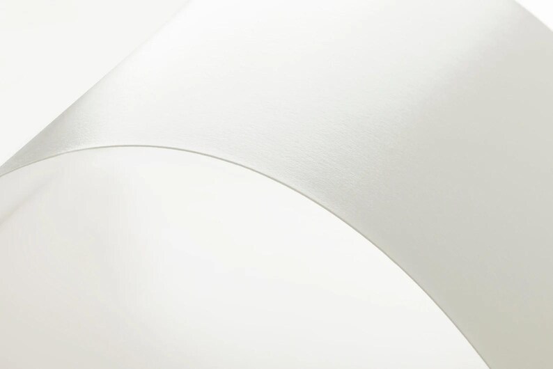 a close up of a white object on a white surface