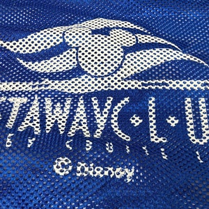 May include: Blue mesh bag with a white logo that says "Castaway Club" with a white Disney logo underneath.