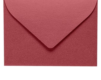 May include: A burgundy envelope with a pointed flap.