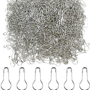 May include: A large pile of silver safety pins, with six individual safety pins displayed below. The safety pins are all the same size and shape, with a rounded head and a pointed end.