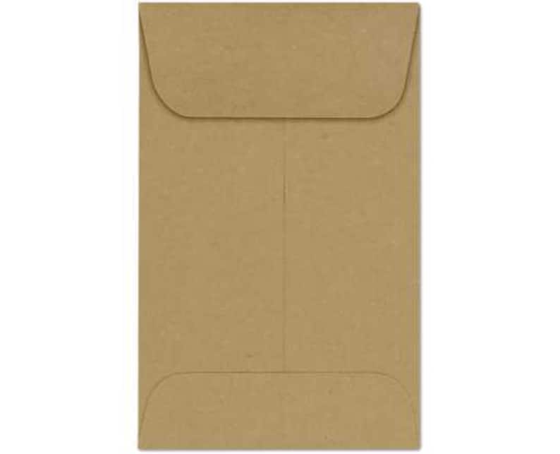 May include: A rectangular, brown paper envelope with a flap closure. The envelope is a light brown color and has a vertical seam down the center. The flap is curved and folds over the top of the envelope.