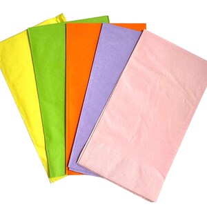 May include: Five tissue paper napkins in different colors: yellow, green, orange, purple, and pink. The napkins are folded and stacked on top of each other.