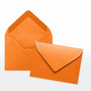 May include: Two orange envelopes, one larger than the other, with a textured surface.