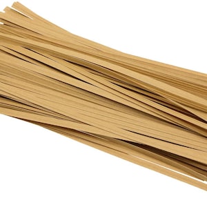 May include: A bundle of brown paper twist ties. The ties are thin and flat, and they are arranged in a neat pile.