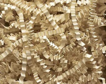 May include: A close-up of a pile of crinkled, ivory-colored paper shreds. The paper is used for packing and filling gift boxes.