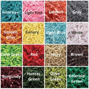 May include: A collection of 16 different colors of shredded paper, including pastel blue, light pink, salmon, gray, golden, canary, light blue, white, lime green, red, ivory, brown, burgundy, hunter green, olive green, and emerald green.