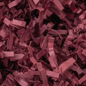 May include: Burgundy shredded paper, a decorative filler for gift baskets and boxes.