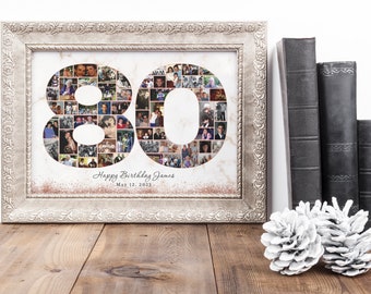 May include: A framed photo collage in a silver frame with a marble background. The collage is in the shape of the number 80, made up of smaller photos. The text "Happy Birthday James May 12, 2023" is printed below the collage.