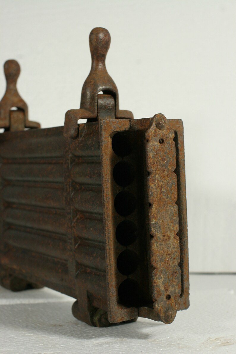 Taper candle mold antique French cast iron hinged 12 candle mold late 1800s to early 1900s used in churches /& monasteries