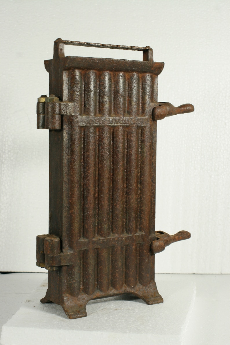 Taper candle mold antique French cast iron hinged 12 candle mold late 1800s to early 1900s used in churches /& monasteries