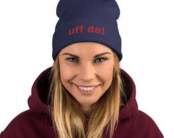 May include: A navy blue beanie with the text "uff da!" embroidered in red.