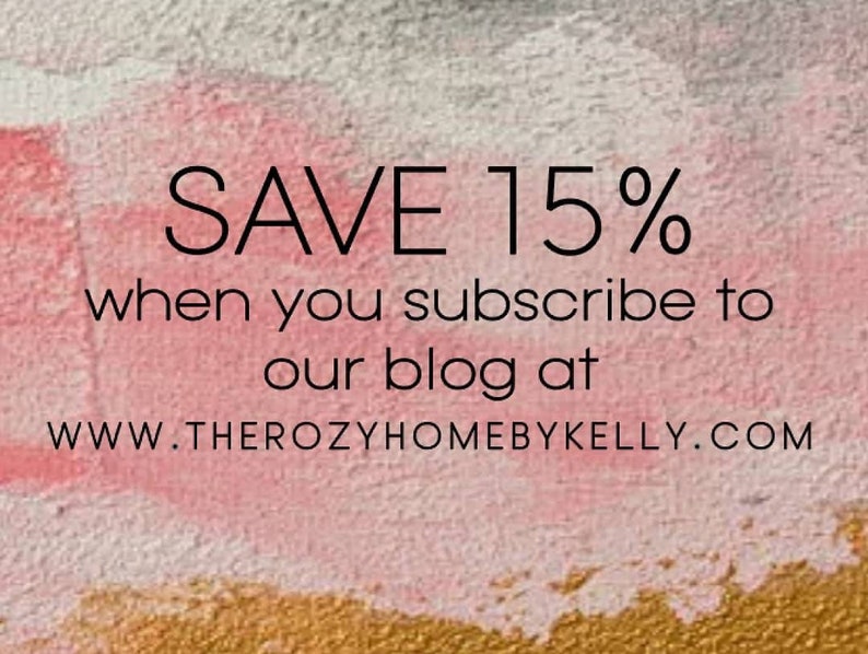 May include: Text on a pink and gold background reads "SAVE 15% when you subscribe to our blog at WWW.THEROZYHOMEBYKELLY.COM". The background has a watercolor effect with pink, white, and gold colors.