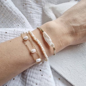 Dainty elastic adjustable bracelet with a long irregular freshwater bead and gold stainless beads on gold elastic thread. Layering bracelet. image 2