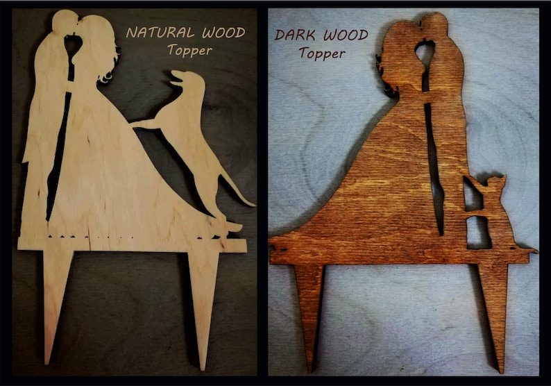 May include: Two wooden cake toppers depicting a bride and groom kissing. The topper on the left is made of natural wood and features a dog. The topper on the right is made of dark wood and features a cat. Both toppers have the text "Topper" on them.
