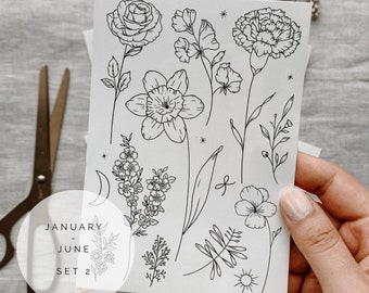 May include: A sheet of black and white floral illustrations. The sheet includes a rose, daffodil, carnation, and other floral designs. The text "JANUARY - JUNE SET 2" is in the lower left corner.