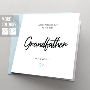May include: White card with a blue envelope. The card has black text that says "Happy Father's Day to the Best Grandfather in the World". There is a small blue heart at the bottom of the card.
