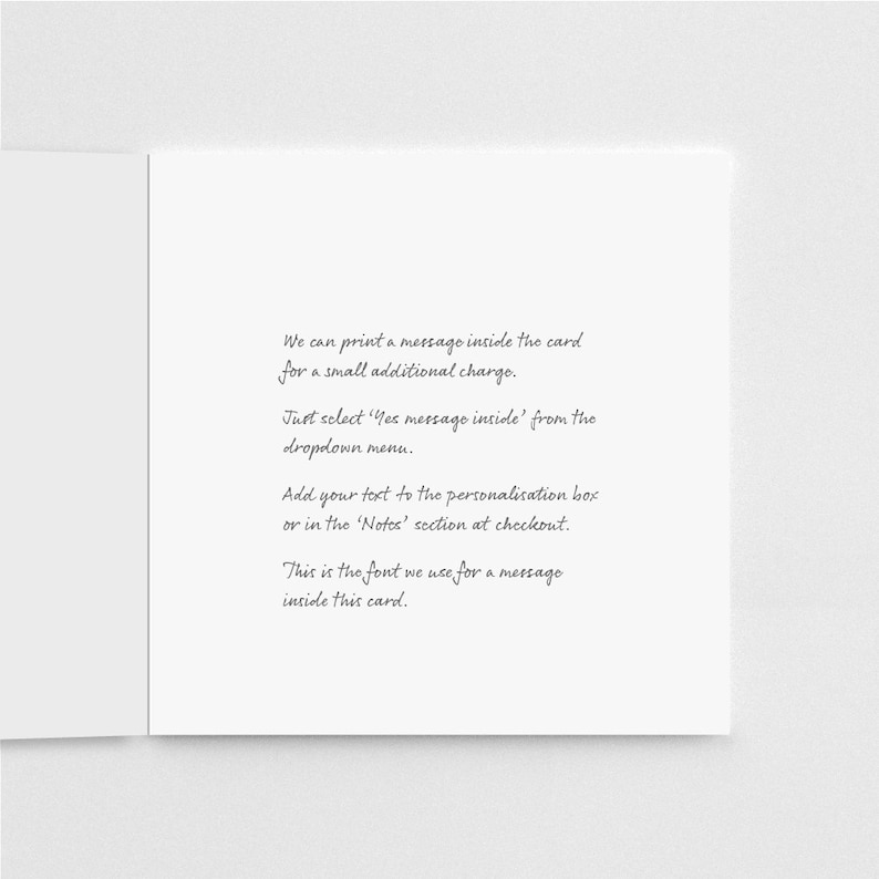 May include: A white card with a message explaining how to add a personalized message inside the card. The text reads: "We can print a message inside the card for a small additional charge. Just select 'Yes message inside' from the dropdown menu. Add your text to the personalization box or in the 'Notes' section at checkout. This is the font we use for a message inside this card."