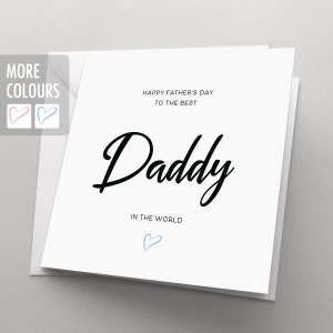 May include: White card with black text that reads "Happy Father's Day to the Best Daddy in the World". A blue heart is at the bottom of the card.