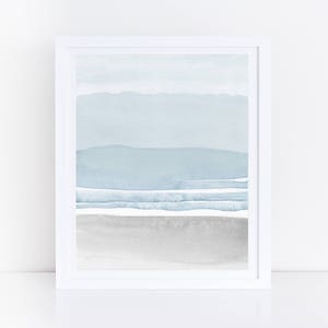 May include: Abstract watercolor painting with a blue and gray color scheme. The painting depicts a landscape with mountains and a beach.
