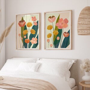 Colorful floral art print set hanging above the bed in a bedroom