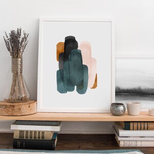 May include: Abstract art print with a white background and a cluster of overlapping shapes in shades of teal, brown, black, and pink.