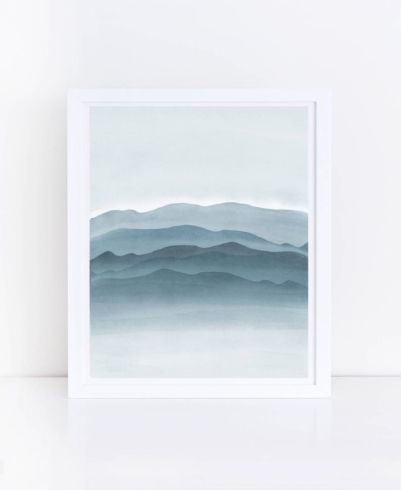 May include: A watercolor painting of a blue mountain range with a light blue sky in the background.