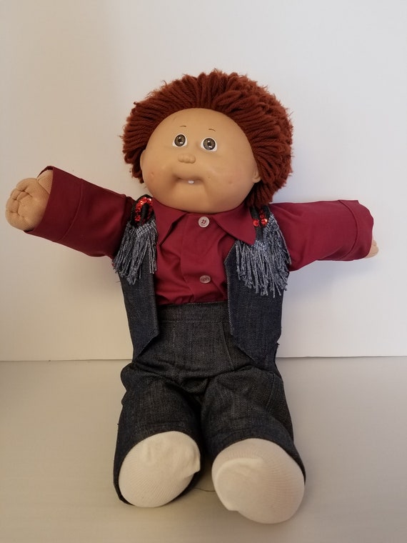 brown haired cabbage patch doll boy