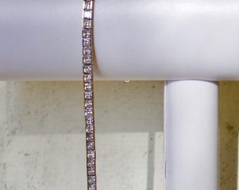 14k solid white gold tennis bracelet with cubic zirconia. 7.5 inches