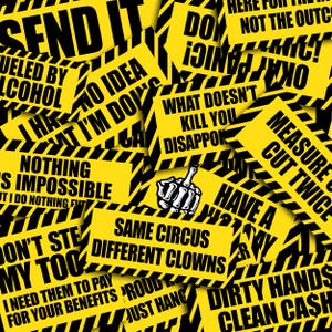 May include: A collection of rectangular yellow stickers with black diagonal striped borders, featuring various black text phrases including "SEND IT," "NOTHING IS IMPOSSIBLE," "SAME CIRCUS DIFFERENT CLOWNS," and a central graphic of a skeleton hand gesture.