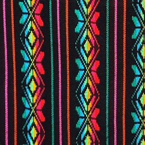 May include: Close-up of a black fabric with a vibrant, colorful pattern. The design features vertical stripes in orange, pink, and green, interspersed with repeating geometric floral motifs in red, yellow, blue, and green.