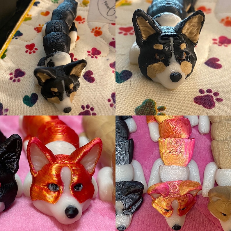 May include: A collection of 3D printed figurines of corgis in various poses. The figurines are painted in black, white, and orange.
