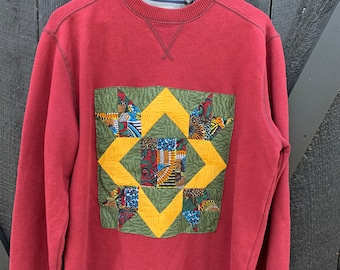 Sudadera de cuello redondo con parche de colcha