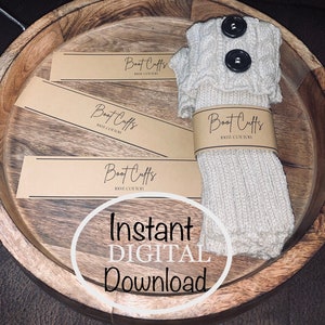 May include: Three brown paper tags with the text "Boot Cuffs 100% Cotton" and a pair of beige knitted boot cuffs with two black buttons.
