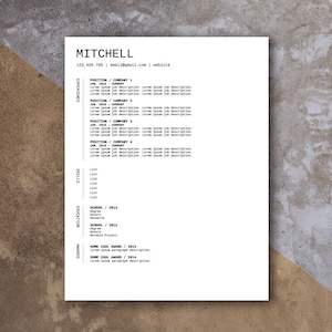 May include: A black and white resume with the name "MITCHELL" at the top. The resume includes contact information, experience, skills, education, and awards.