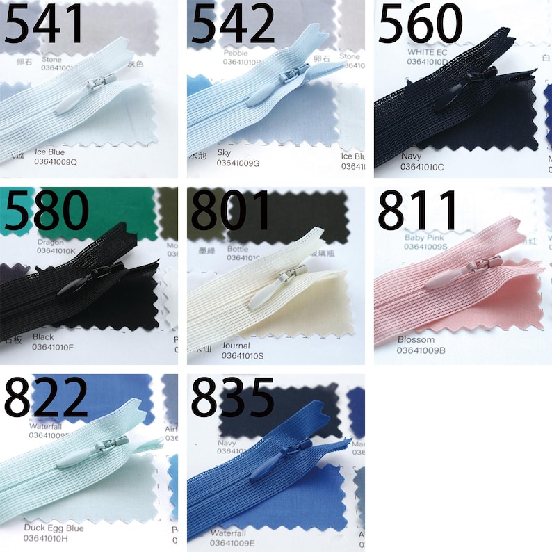 May include: A collection of nine zippers in various colors, including light blue, navy, and pink. Each zipper is displayed on a swatch of matching fabric. The numbers 541, 542, 560, 580, 801, 811, 822, and 835 are printed above each zipper.