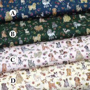 May include: Close-up of four fabric swatches with dog patterns. The fabrics are in navy, green, light pink, and cream. Each fabric features various dog breeds and floral designs. The fabrics are suitable for sewing projects.