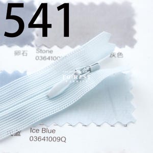 May include: A light blue zipper with a white pull tab, labeled "Ice Blue" and "03641009Q". The number "541" is printed in large black font above the zipper. A fabric swatch is visible in the background.
