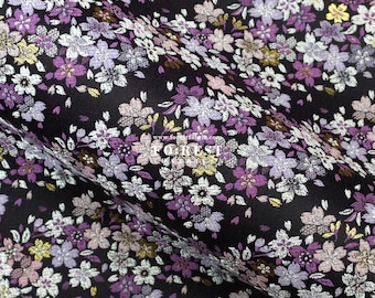 May include: Black fabric with a floral pattern in shades of purple, white, and gold. The fabric has a brocade texture.