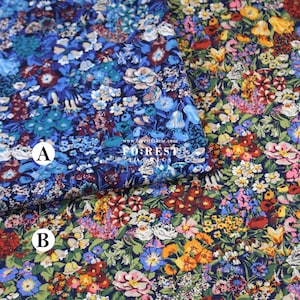 May include: Two floral fabric samples. One is mainly blue with various flower types. The other features a mix of colourful flowers on a dark background. The text "FOREST" is visible.