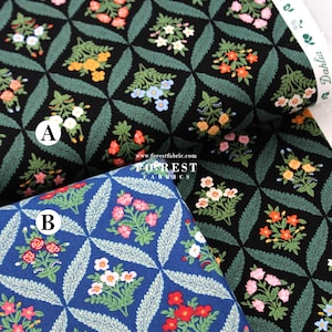 Pode incluir: Close-up de dois padrões de tecido floral. Um é preto com flores coloridas e folhas verdes, o outro é azul com flores vermelhas e brancas. O tecido tem um padrão de diamante repetido. O texto "FOREST FABRICS" é visível.