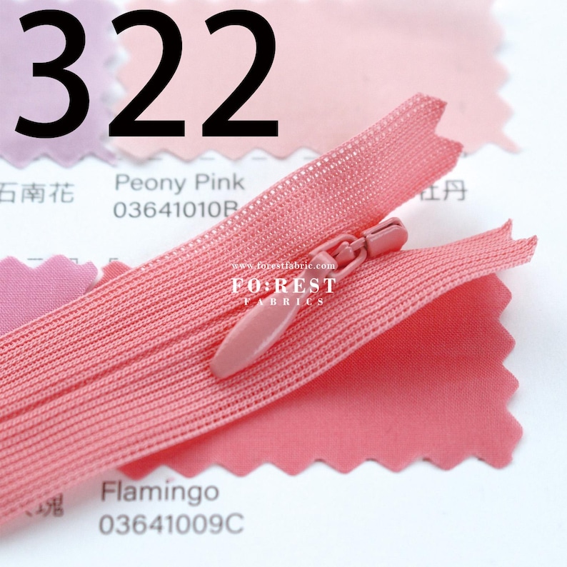 May include: A close-up of a pink zipper with a matching pull tab, set against a backdrop of pink fabric swatches. The number "322" is prominently displayed in black. The fabric swatches are labeled "Peony Pink" and "Flamingo".