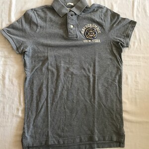 T-shirt grigia da uomo Abercrombie And Fitch Polo Golf, taglia